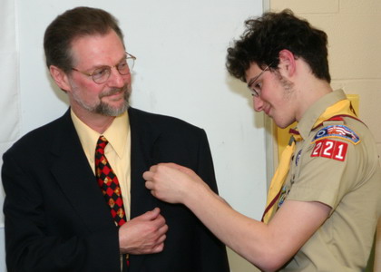 Being awarded the merit badge for fathering