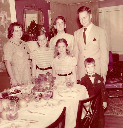 A young Arthur (bottom right) with family